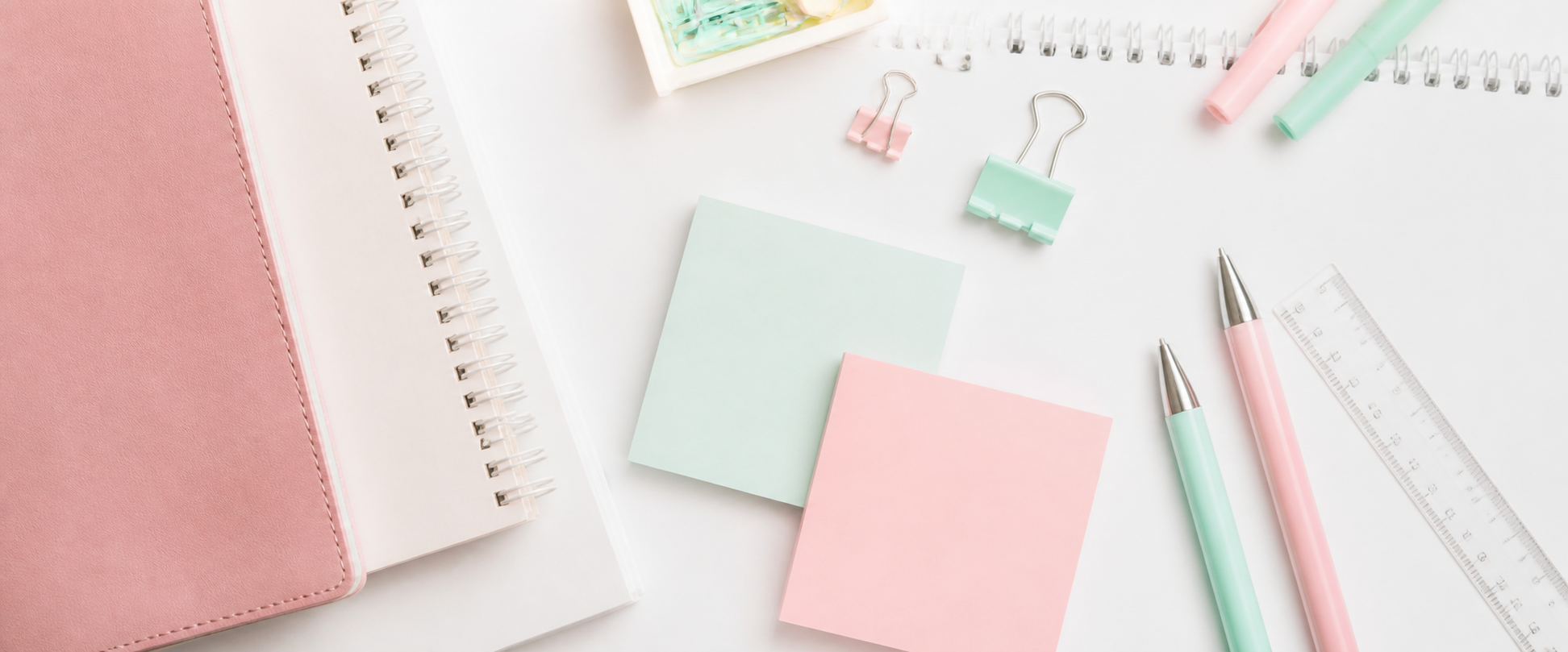 Pastel planning supplies arranged on a desk